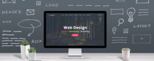 Computer displaying a website with concept sketch in background