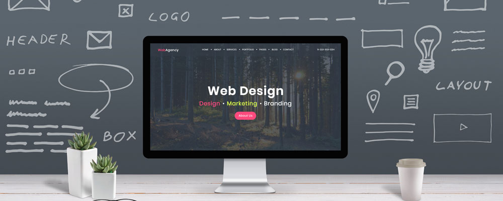 Computer displaying a website with concept sketch in background