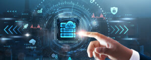 photo composite containing hand pointing to cloud computing icon.