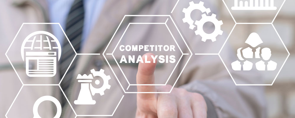 business person pointing to competitive analysis graphic
