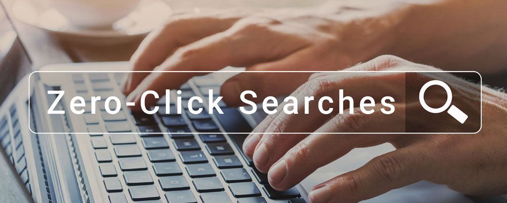 hands typing on keyboard with the words: "zero-click search" superimposed