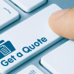finger selecting "get a quote" buton on computer keyboard