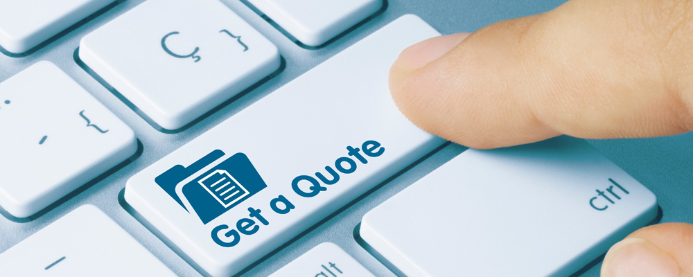 finger selecting "get a quote" buton on computer keyboard