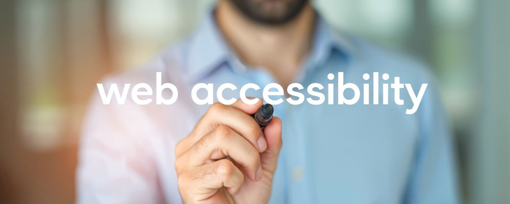 man pointing at the words web accessibility